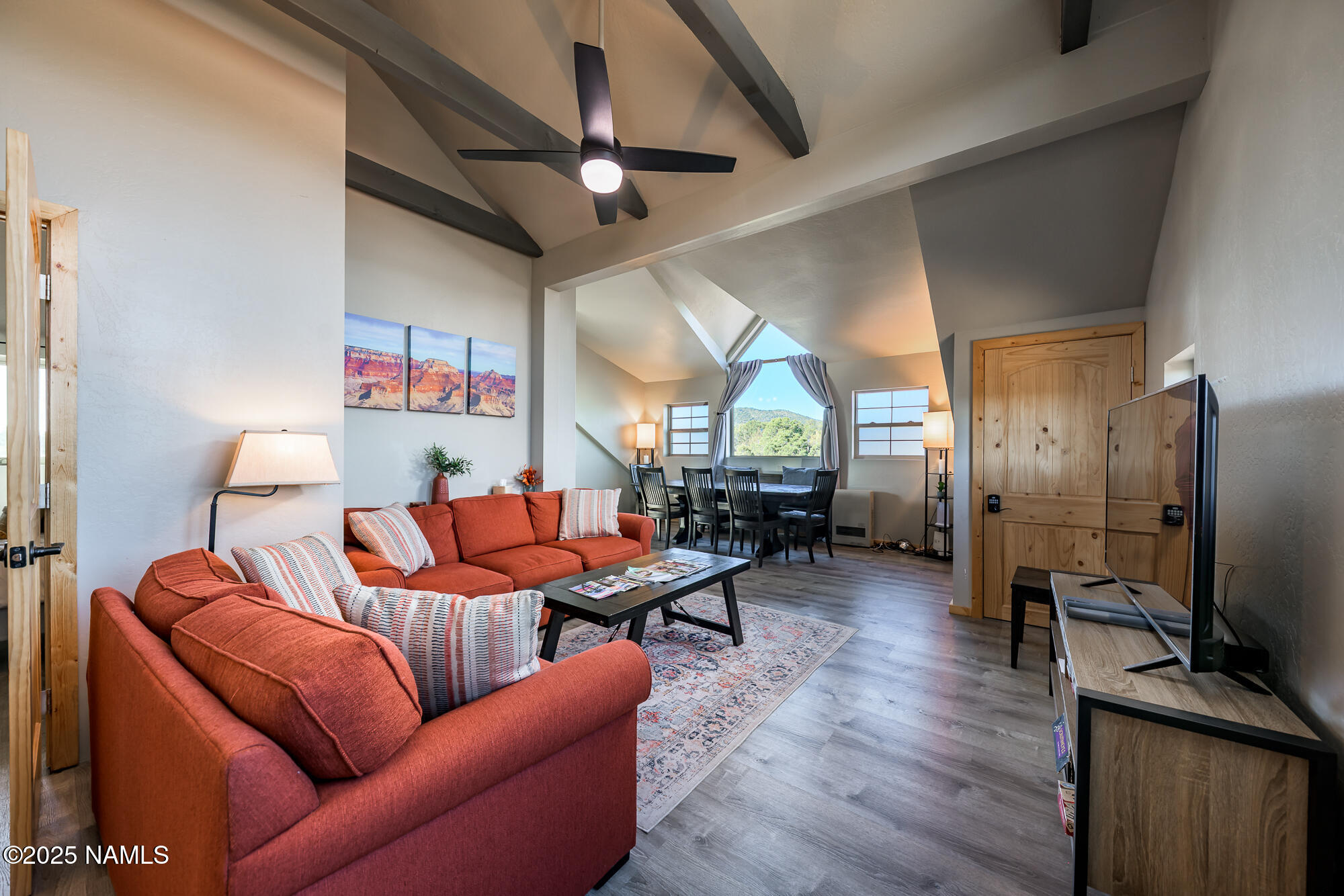 224 East San Marcos Road Williams, AZ 86046 - Photo 9 of 58 a living room with furniture kitchen view and a wooden floor