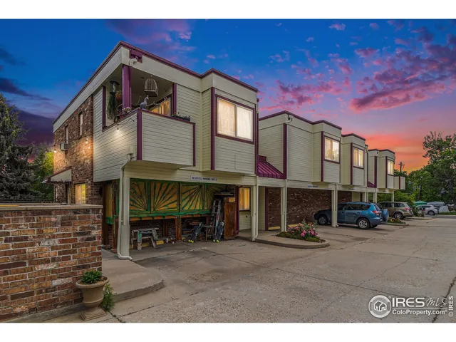 a view of a building with sitting area