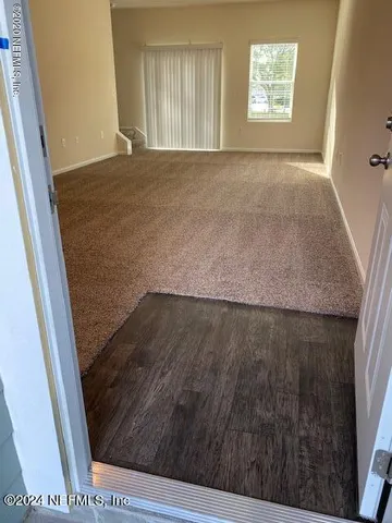 an entryway view with wooden floor