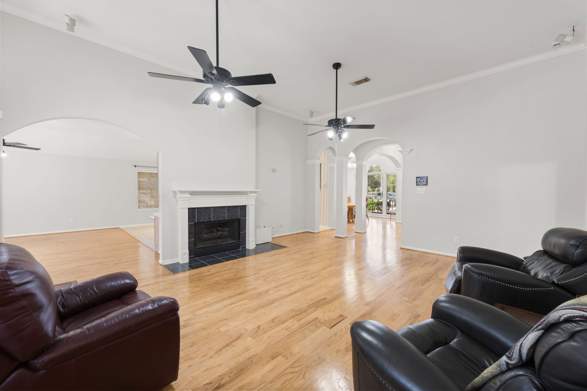1614 Mercoal Drive Spring, TX 77386 - Photo 12 of 50 A family-focused living space with a natural gas fireplace invites everyone to relax, connect, and enjoy time together.