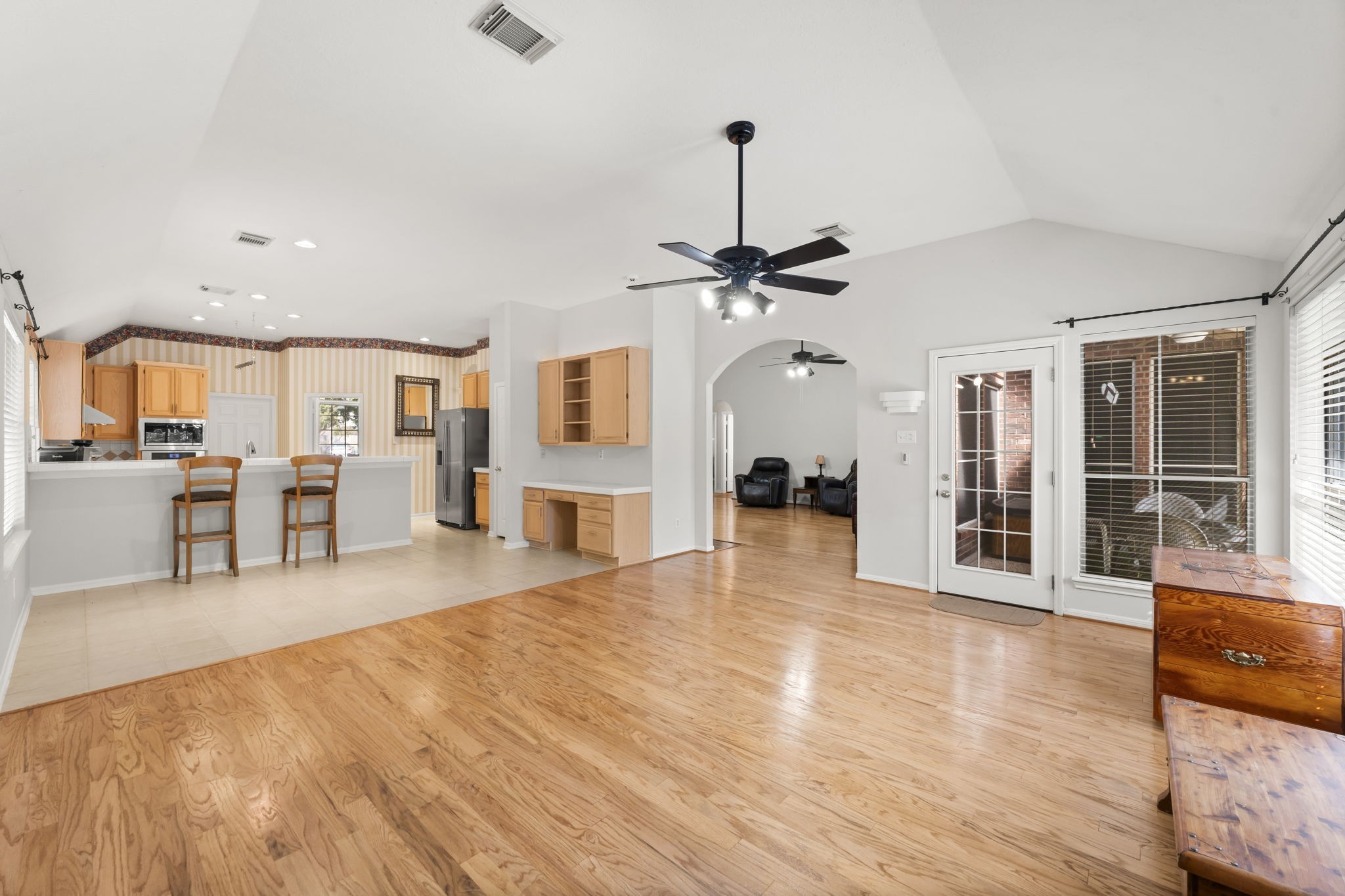 1614 Mercoal Drive Spring, TX 77386 - Photo 14 of 50 Designed for daily living, the family room, casual dining area, and kitchen form a connected space where family can cook, eat, and relax together.