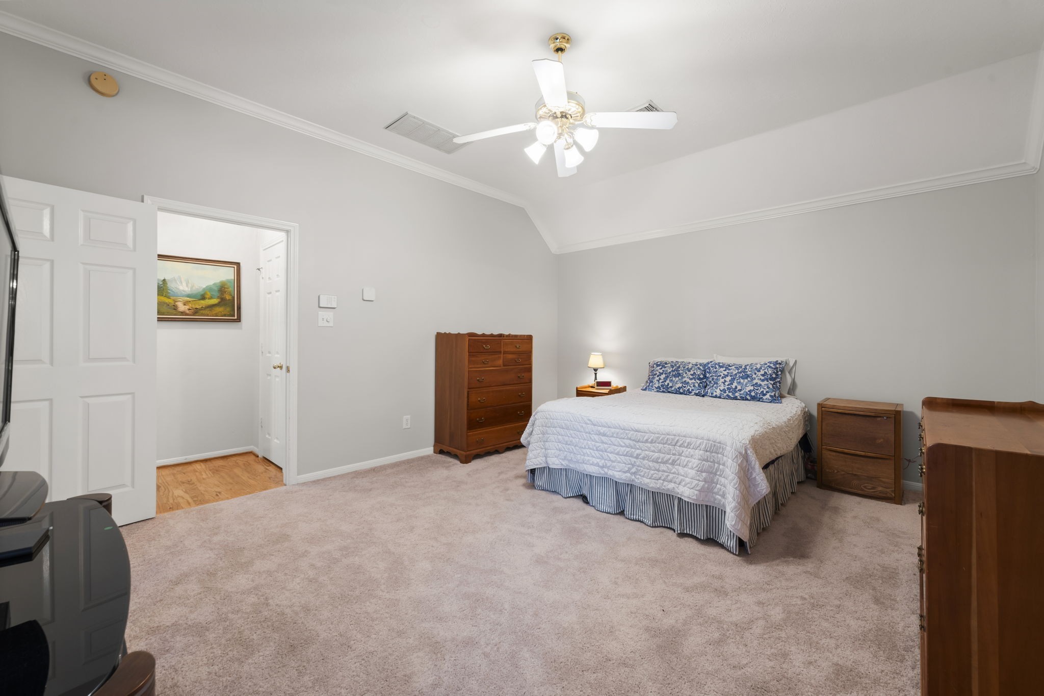1614 Mercoal Drive Spring, TX 77386 - Photo 23 of 50 This large primary bedroom is warm and inviting, with room to create your personal haven, flowing into a private ensuite bath for everyday ease.