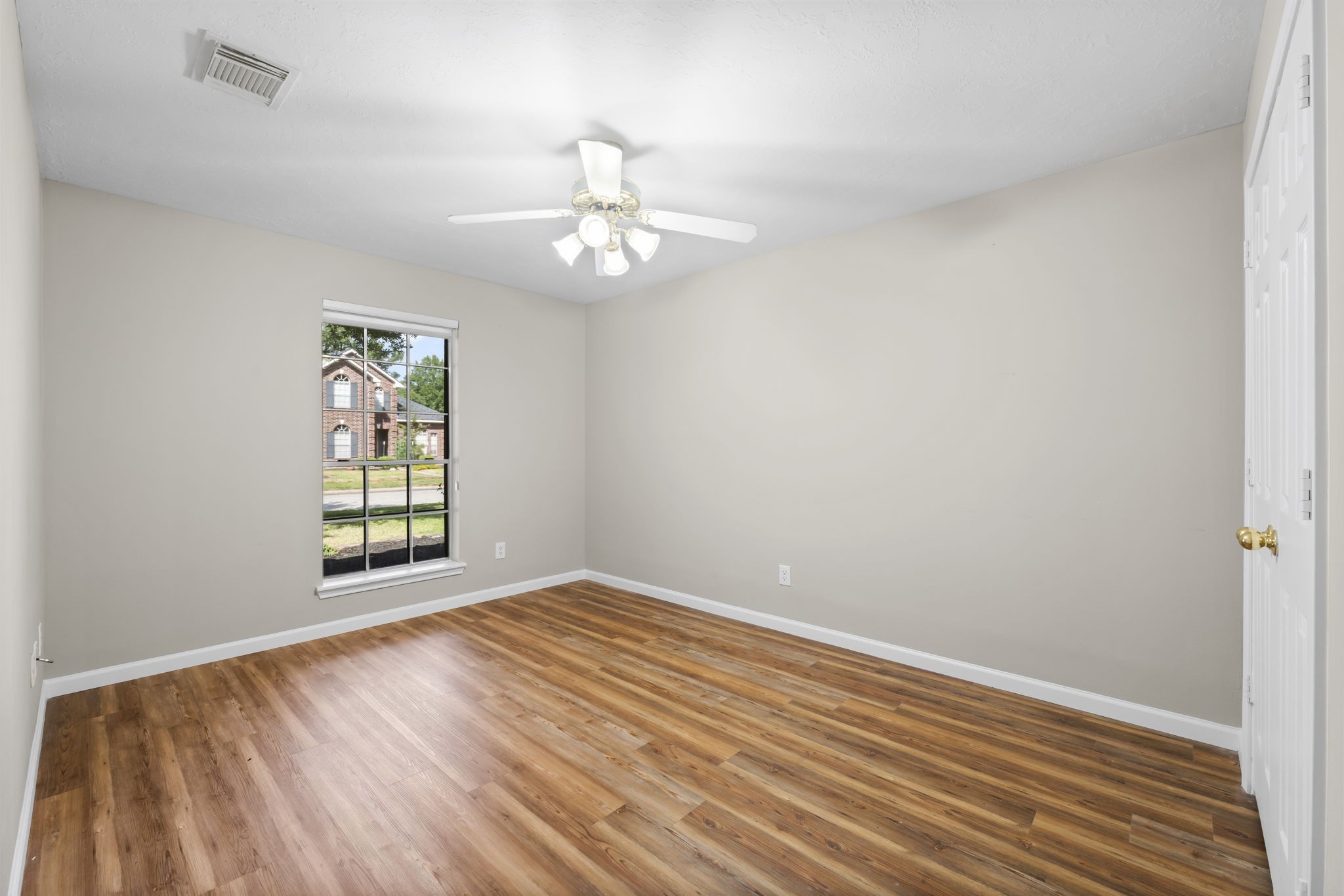 1614 Mercoal Drive Spring, TX 77386 - Photo 31 of 50 The large guest bedroom offers natural light and rich wood floors, making it a cozy and inviting place to stay for kids or visiting friends and family.