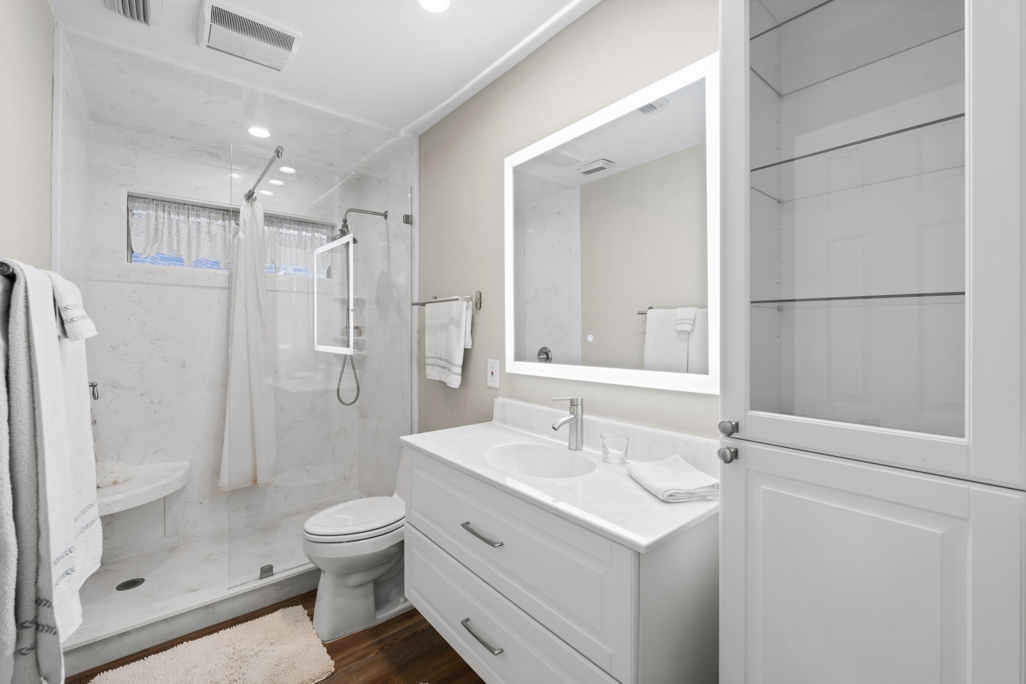 1614 Mercoal Drive Spring, TX 77386 - Photo 33 of 50 The updated guest bathroom combines modern style and convenience, featuring a sleek walk-in shower, contemporary fixtures, and clean lines for a fresh, inviting space.