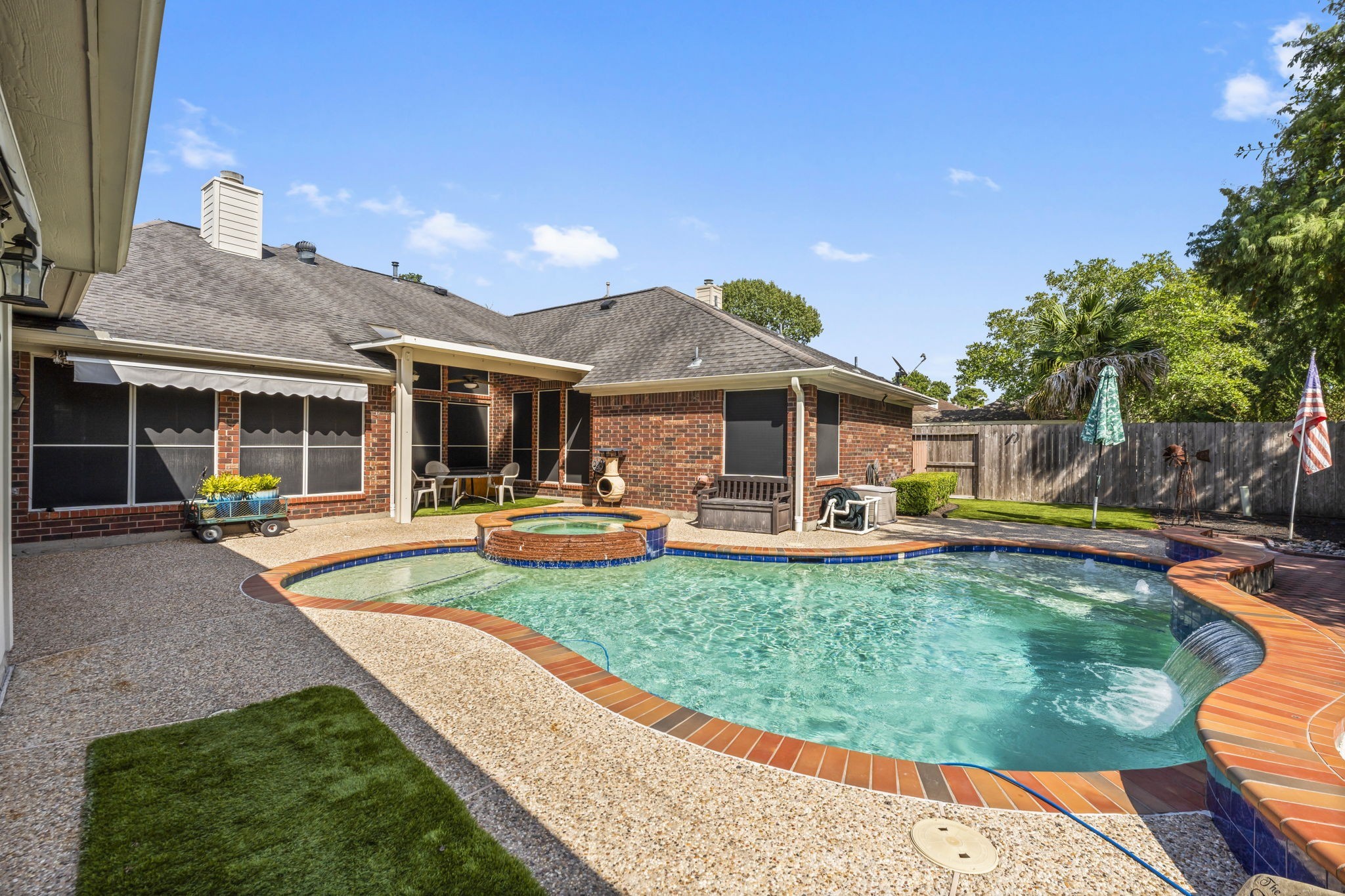 1614 Mercoal Drive Spring, TX 77386 - Photo 36 of 50 Step into a backyard oasis with a pool and spa that support active, healthy living—swim for fitness or soak in the spa to unwind and refresh after a busy day.