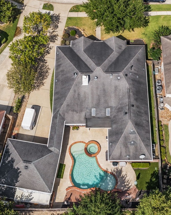 1614 Mercoal Drive Spring, TX 77386 - Photo 42 of 50 An aerial perspective reveals the home’s generous lot, a sparkling pool and spa, and outdoor areas perfect for family living and entertaining.