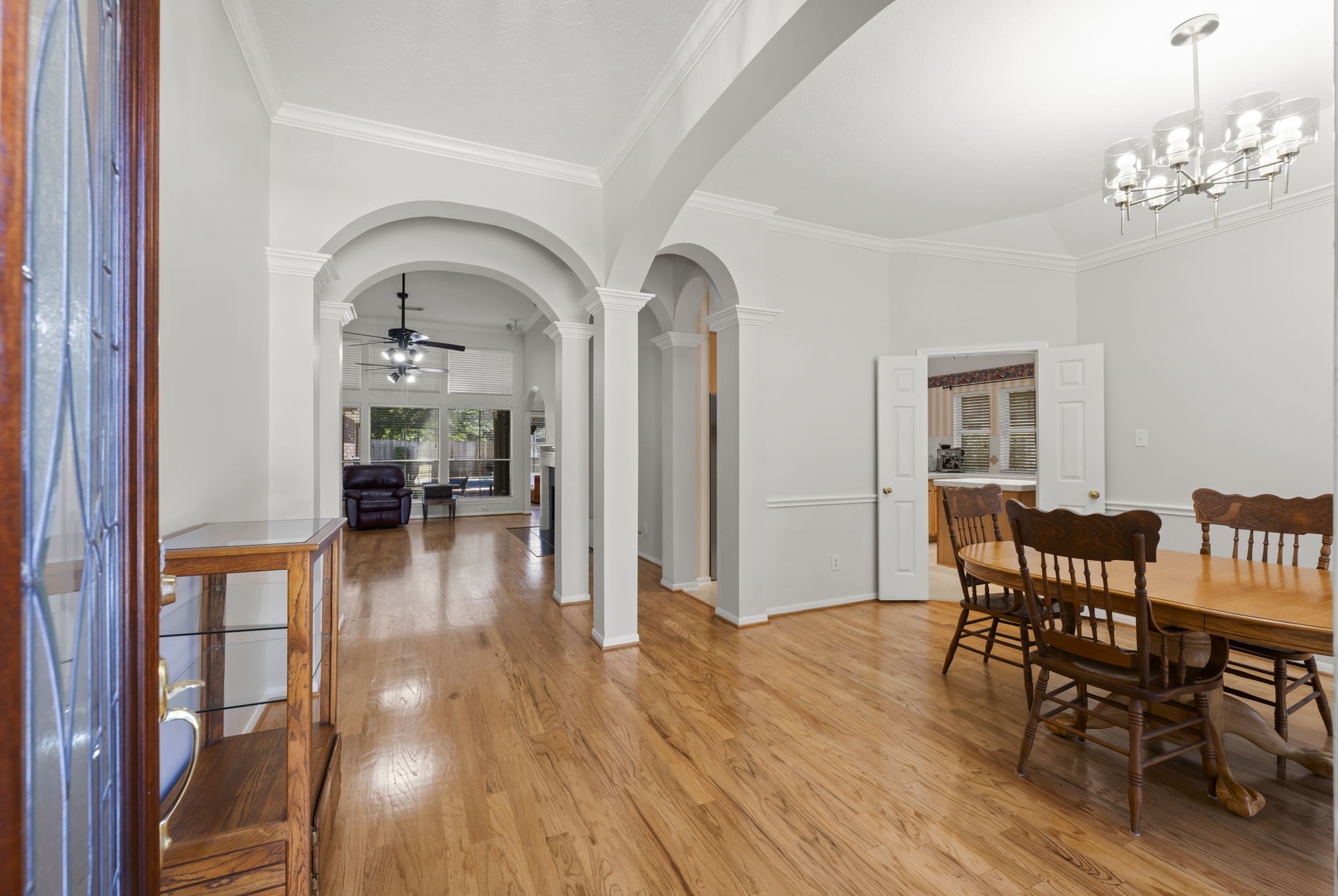 1614 Mercoal Drive Spring, TX 77386 - Photo 6 of 50 Sunlight pours through every corner of this open, inviting, single-story home from the solid oak flooring to the arches guiding you through the home.