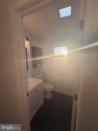 a bathroom with a toilet a sink and shower