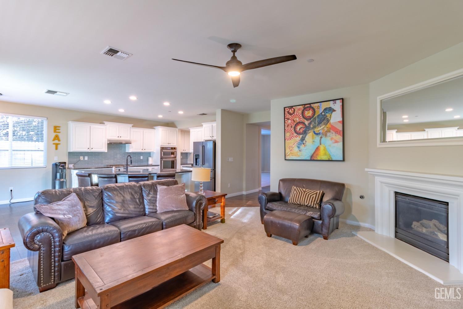 Undisclosed Address Bakersfield, CA 93314 - Photo 13 of 47 a living room with furniture and a fireplace