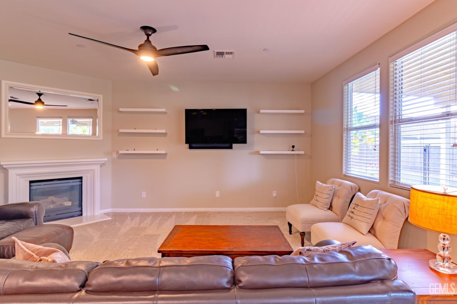 Undisclosed Address Bakersfield, CA 93314 - Photo 14 of 47 a living room with furniture and a flat screen tv