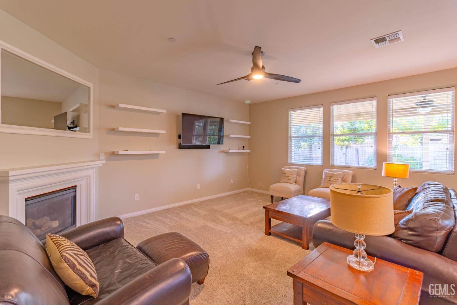 Undisclosed Address Bakersfield, CA 93314 - Photo 15 of 47 a living room with furniture fireplace and a large window