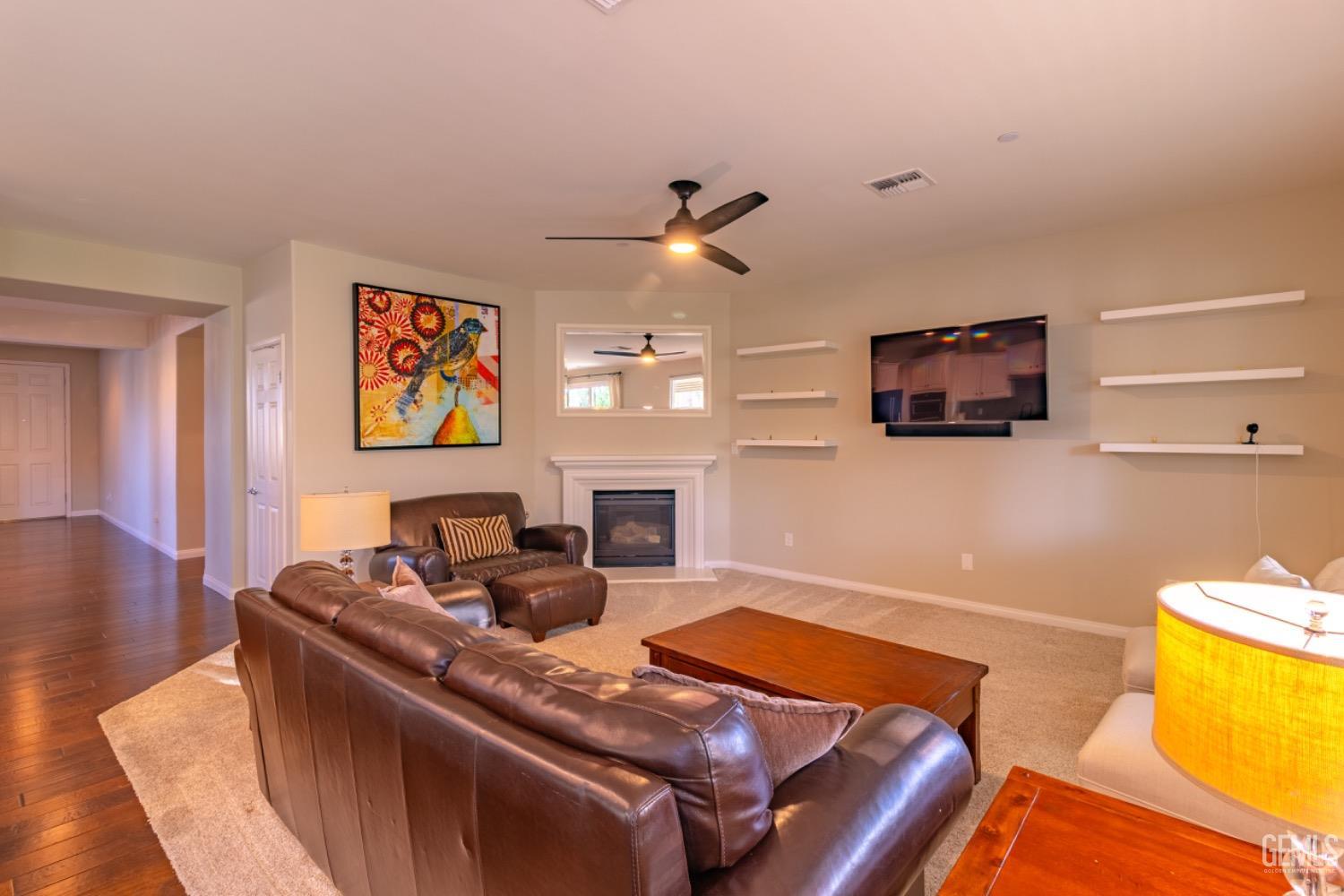 Undisclosed Address Bakersfield, CA 93314 - Photo 17 of 47 a living room with furniture and a flat screen tv
