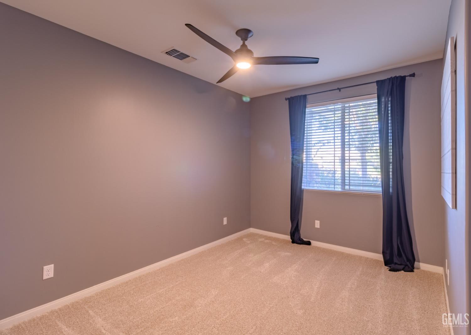 Undisclosed Address Bakersfield, CA 93314 - Photo 19 of 47 a view of an empty room with a window