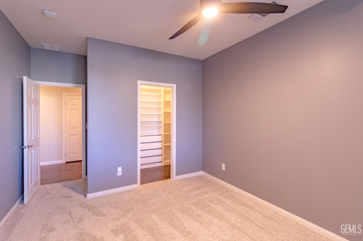 Undisclosed Address Bakersfield, CA 93314 - Photo 20 of 47 an empty room with closet and windows
