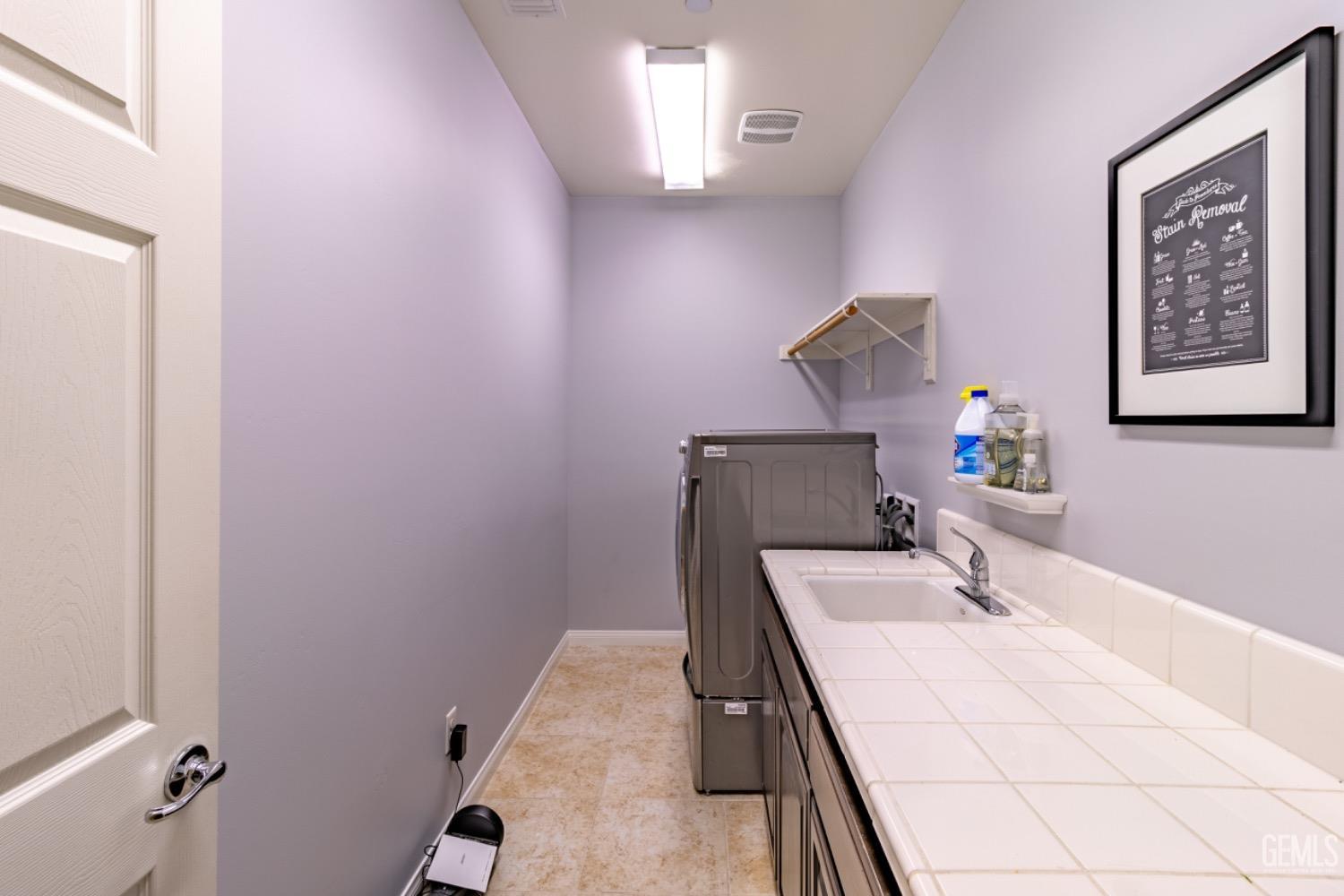 Undisclosed Address Bakersfield, CA 93314 - Photo 23 of 47 a bathroom with a sink and a mirror