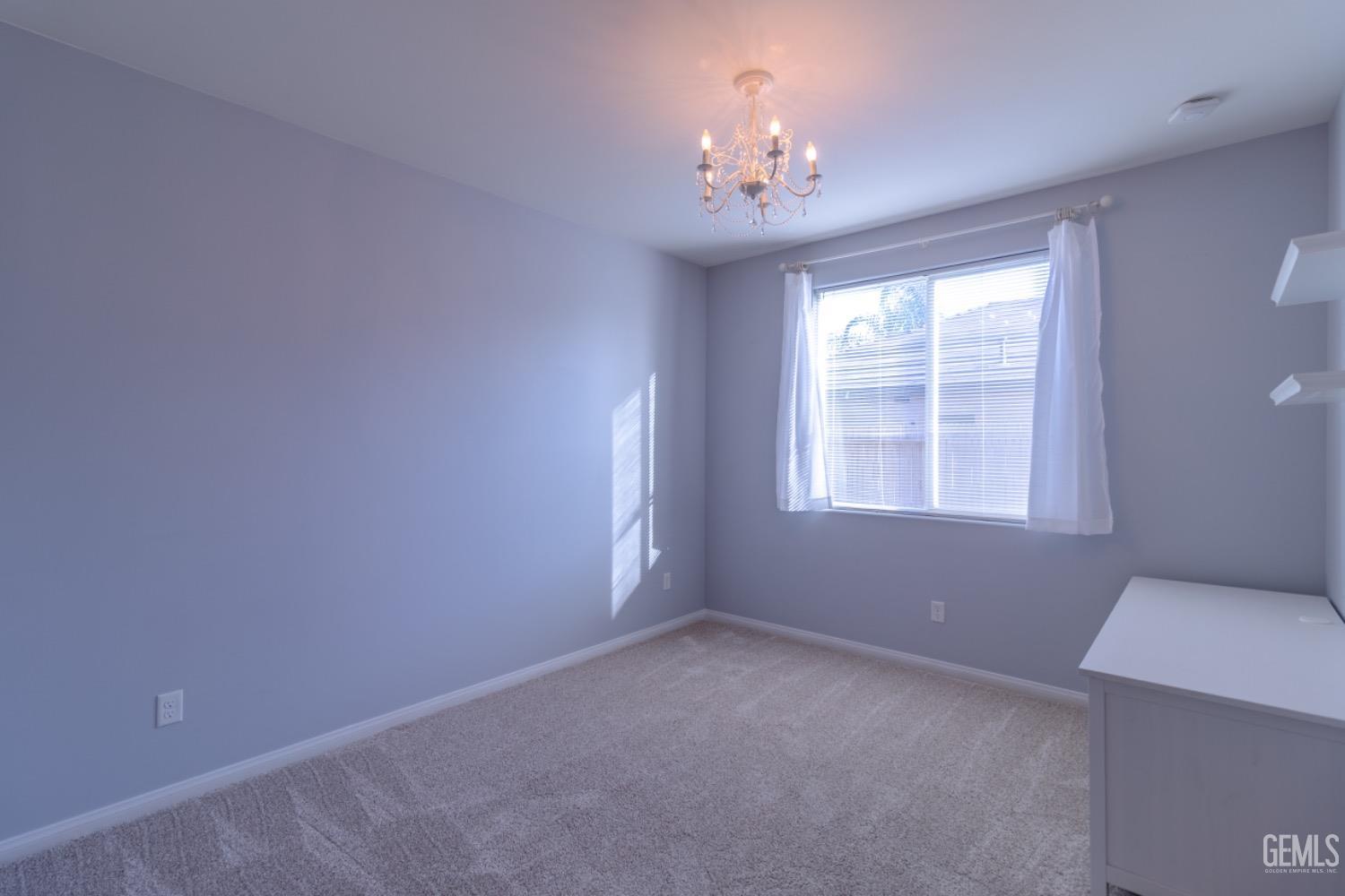 Undisclosed Address Bakersfield, CA 93314 - Photo 25 of 47 a view of an empty room with a window