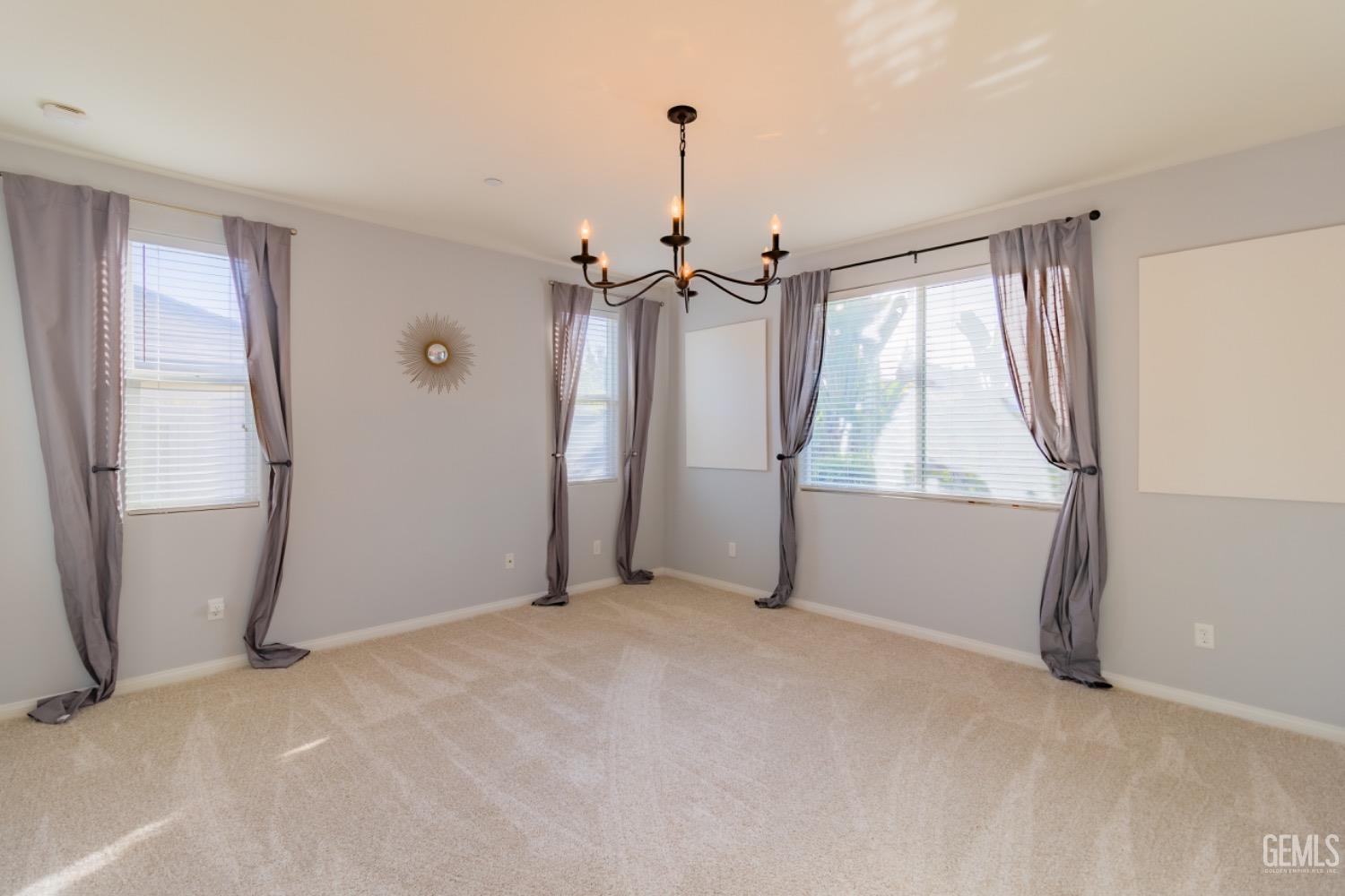 Undisclosed Address Bakersfield, CA 93314 - Photo 30 of 47 a view of a room with window a ceiling fan and refrigerator