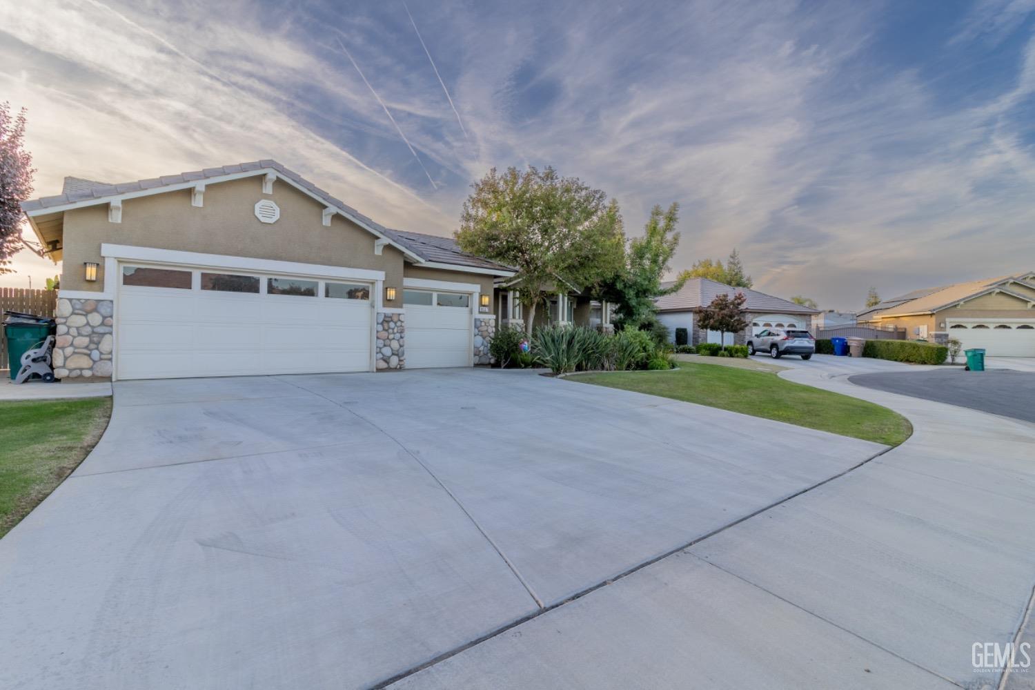Undisclosed Address Bakersfield, CA 93314 - Photo 3 of 47 front view of house with a yard and potted plants