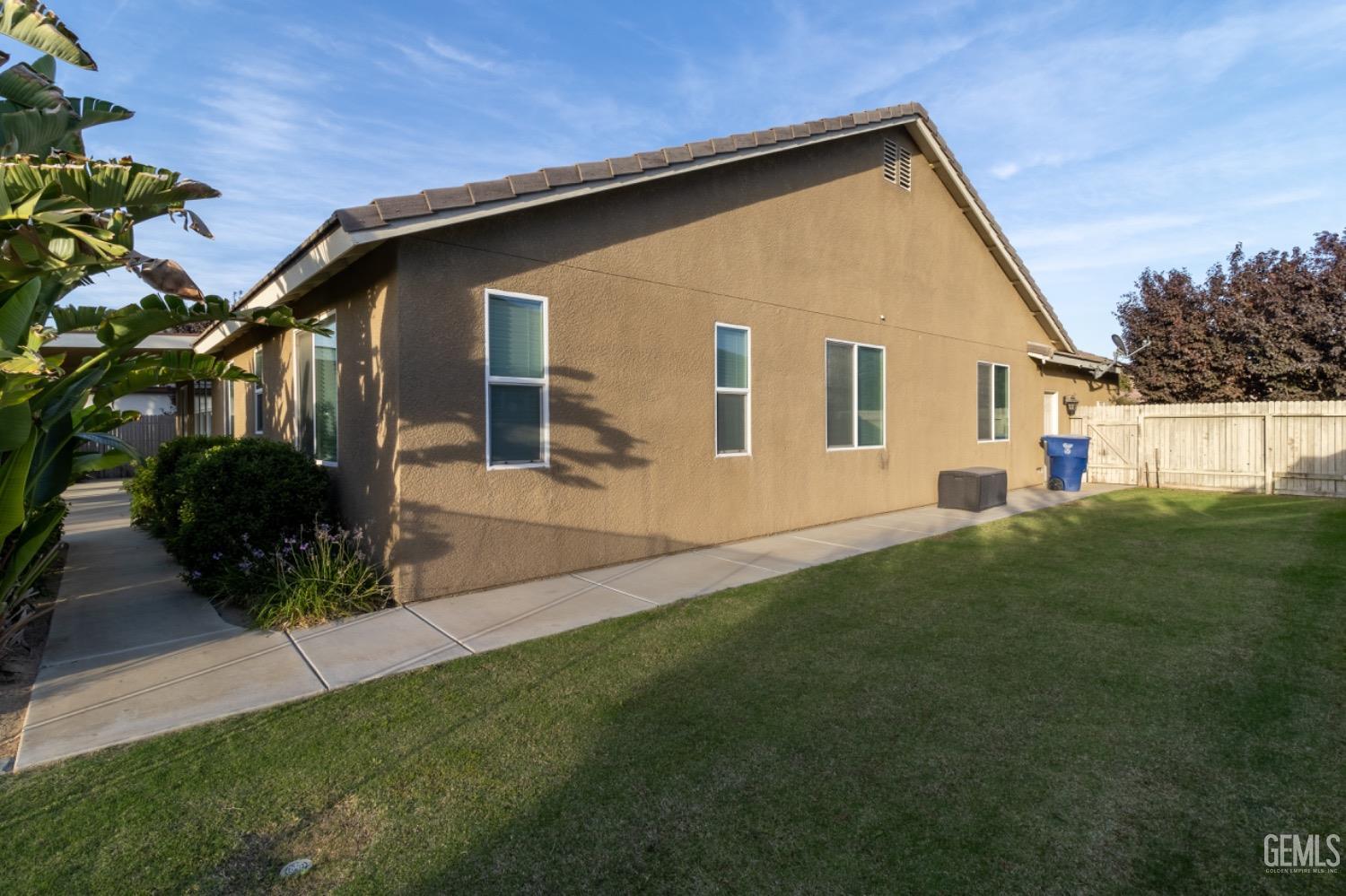 Undisclosed Address Bakersfield, CA 93314 - Photo 45 of 47 a front view of a house with a yard