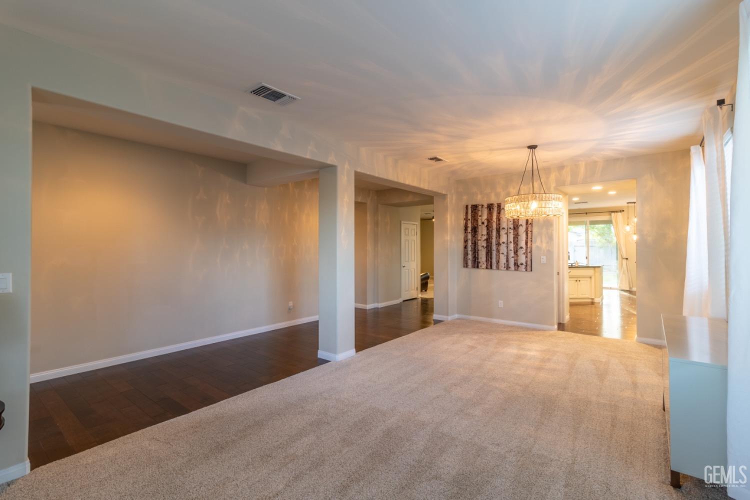 Undisclosed Address Bakersfield, CA 93314 - Photo 5 of 47 a view of a big room with windows and cabinet