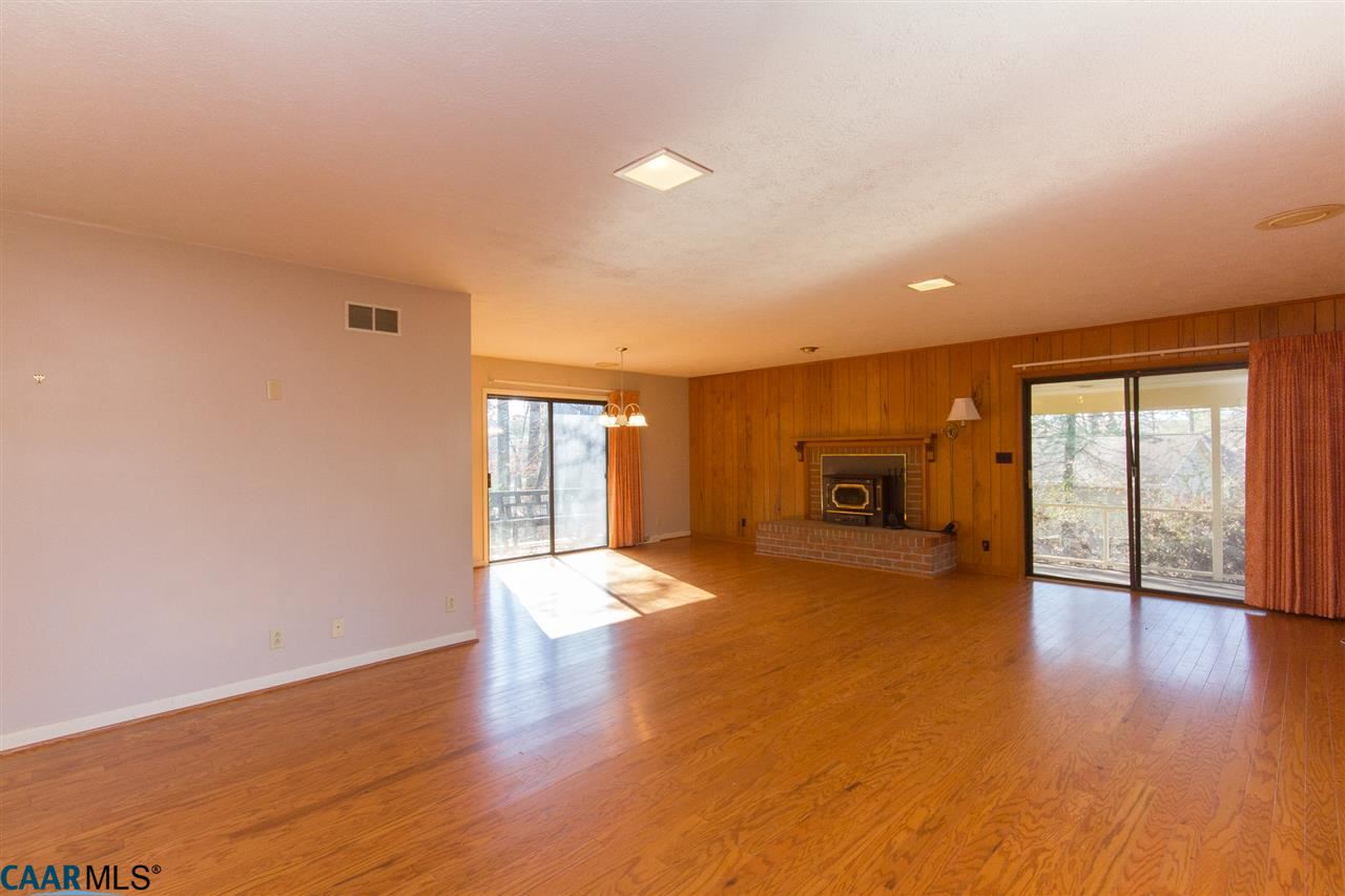 2 Deepwater Point Palmyra, VA 22963 - Photo 3 of 25 This is indeed a "Great Room!" With Hardwoods, Open & Bright, Brick Fireplace, Walk-out To Deck & Screened Porch