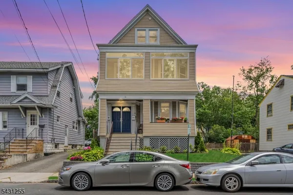 a front view of a house with parking space
