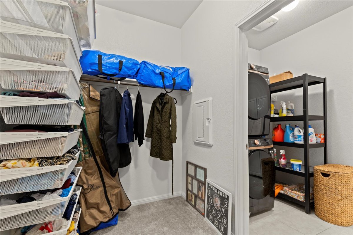 213 Munk Lane Leander, TX 78641 - Photo 18 of 40 a view of walk in closet with clothes and shoes