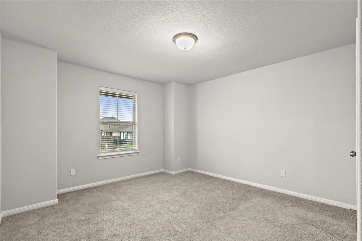 213 Munk Lane Leander, TX 78641 - Photo 26 of 40 an empty room with windows