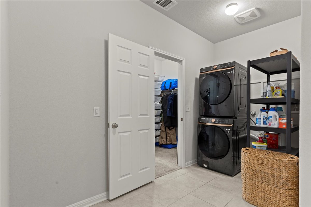 213 Munk Lane Leander, TX 78641 - Photo 32 of 40 a storage room with washer and dryer