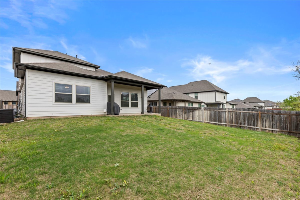 213 Munk Lane Leander, TX 78641 - Photo 35 of 40 a front view of a house with yard and green space