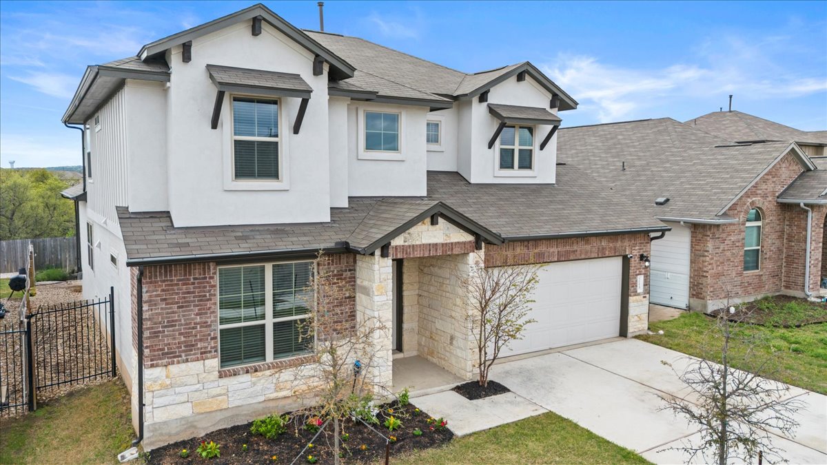 213 Munk Lane Leander, TX 78641 - Photo 4 of 40 a front view of a house with a yard