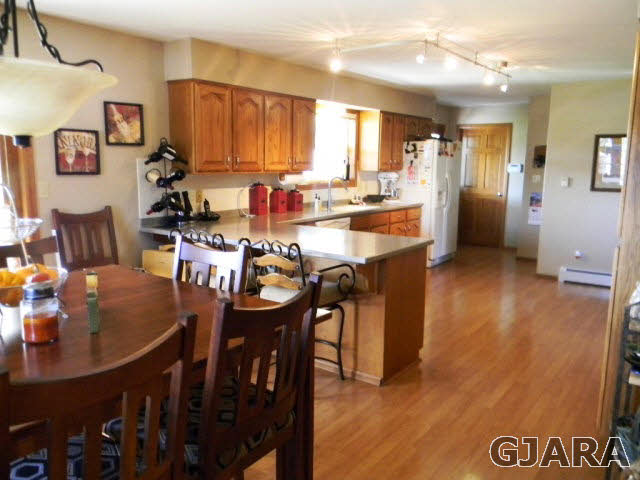 1181-17 17 1/2 Road Fruita, CO 81521 - Photo 24 of 38 a large kitchen with a table and chairs
