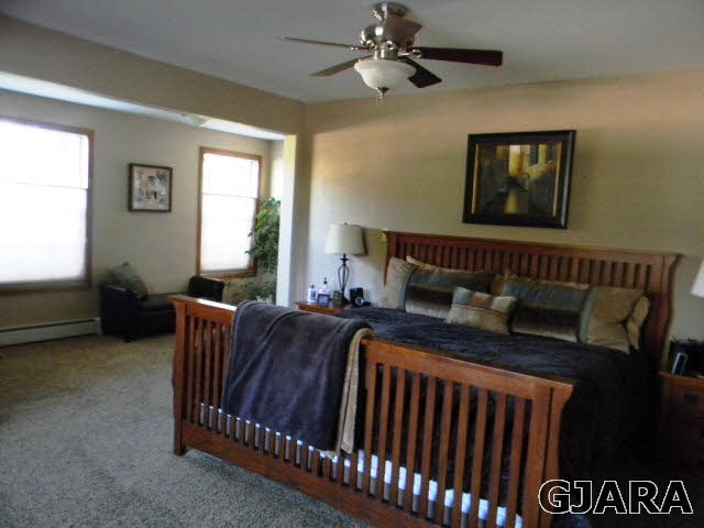 1181-17 17 1/2 Road Fruita, CO 81521 - Photo 30 of 38 a bed sitting in a bedroom next to a window