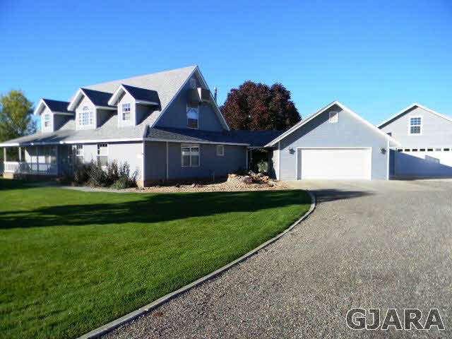 1181-17 17 1/2 Road Fruita, CO 81521 - Photo 38 of 38 a front view of a house with a garden and yard