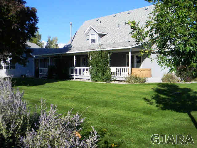 1181-17 17 1/2 Road Fruita, CO 81521 - Photo 8 of 38 a front view of house with yard and green space