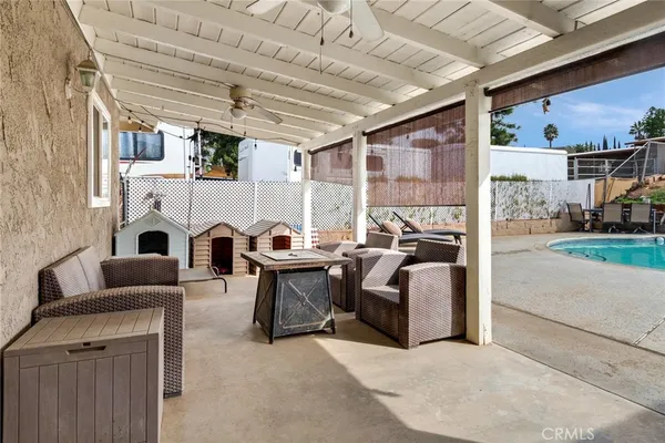 a living room with furniture a fireplace and a table