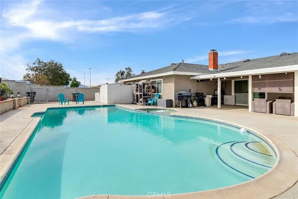 a view of a house with swimming pool