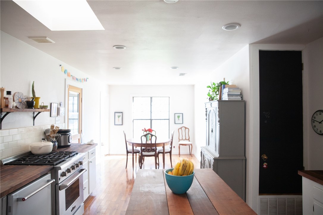 a kitchen with stainless steel appliances granite countertop a stove and a refrigerator