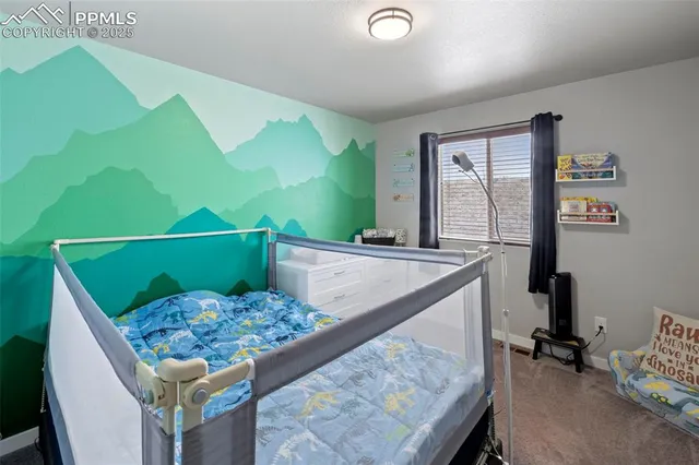 a bedroom with a bed and a dresser