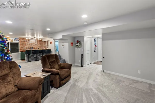 a view of a dining room with furniture and chandelier