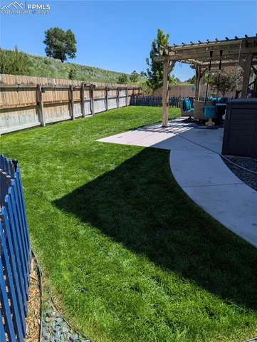 a view of a garden with an outdoor seating