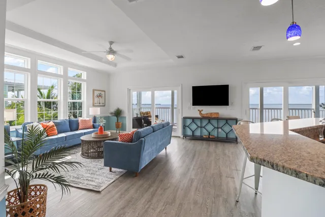 a living room with fireplace furniture and a flat screen tv