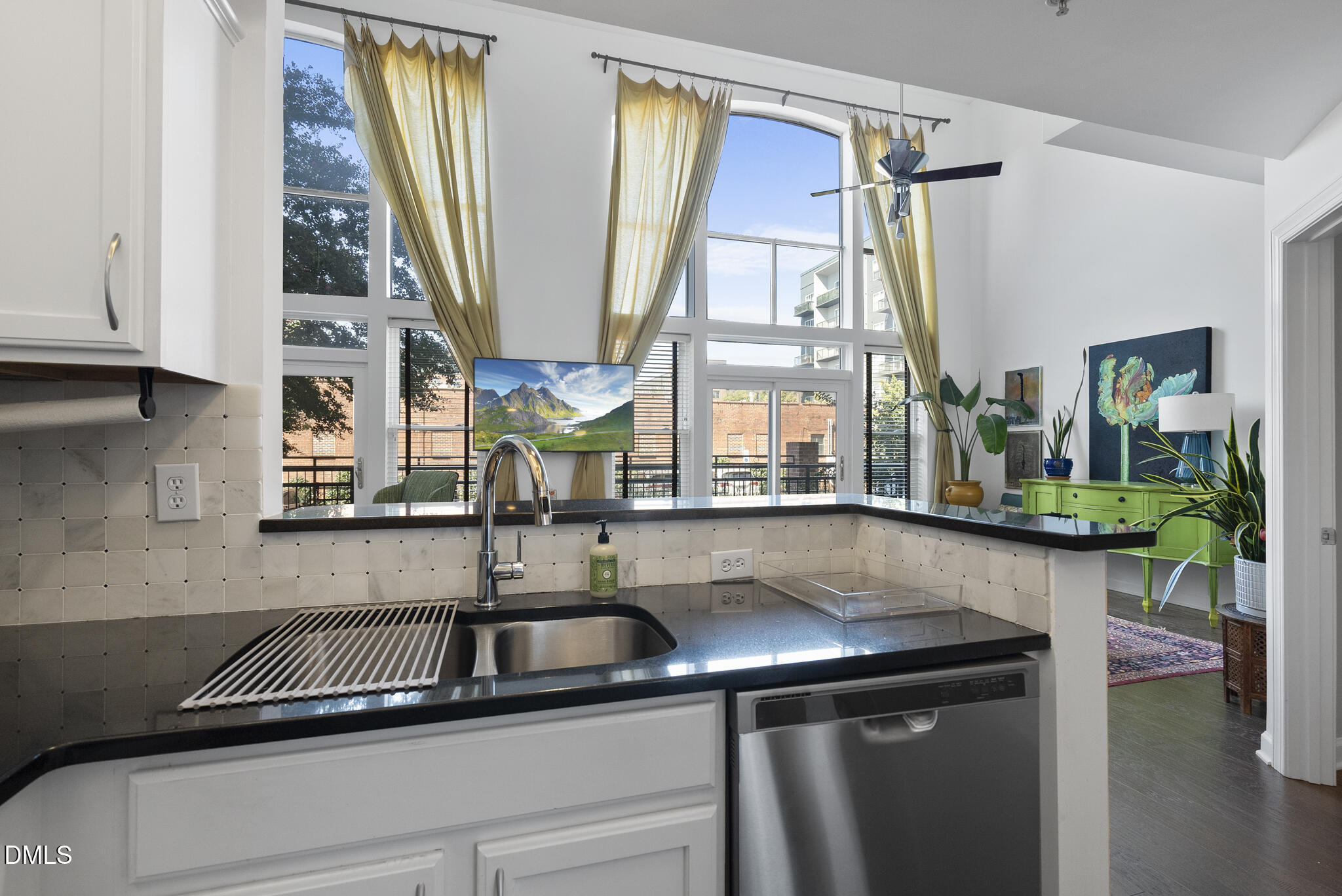 200 South Dawson Street, Unit 111 Raleigh, NC 27601 - Photo 14 of 34 a kitchen with a sink and a window
