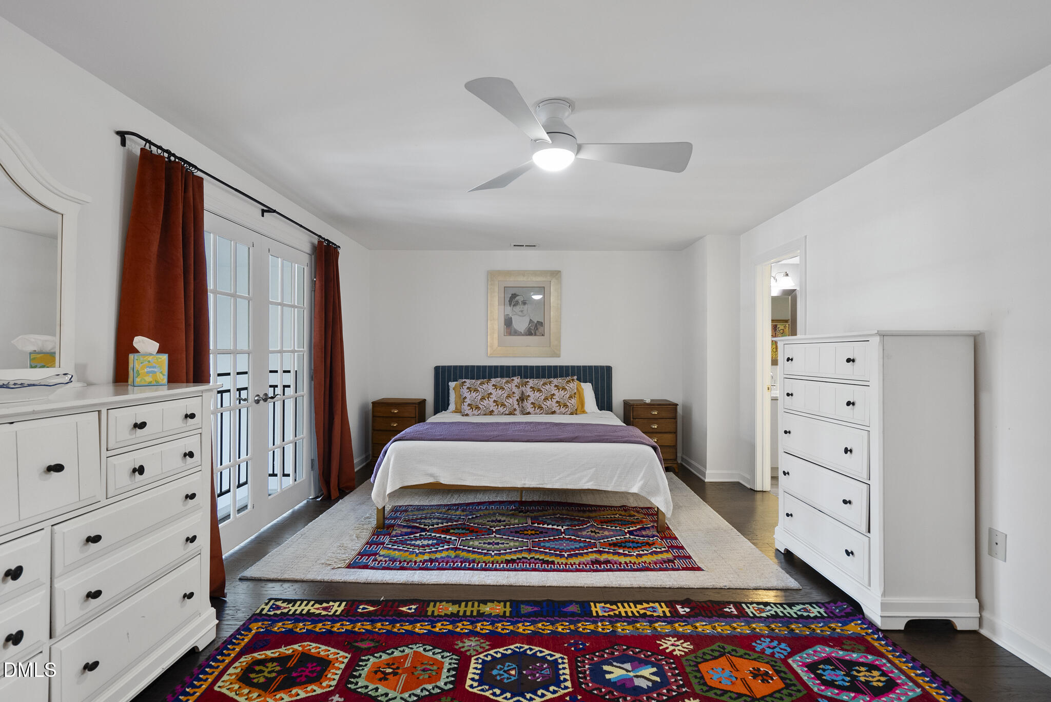 200 South Dawson Street, Unit 111 Raleigh, NC 27601 - Photo 20 of 34 a bedroom with a bed and a dresser in it