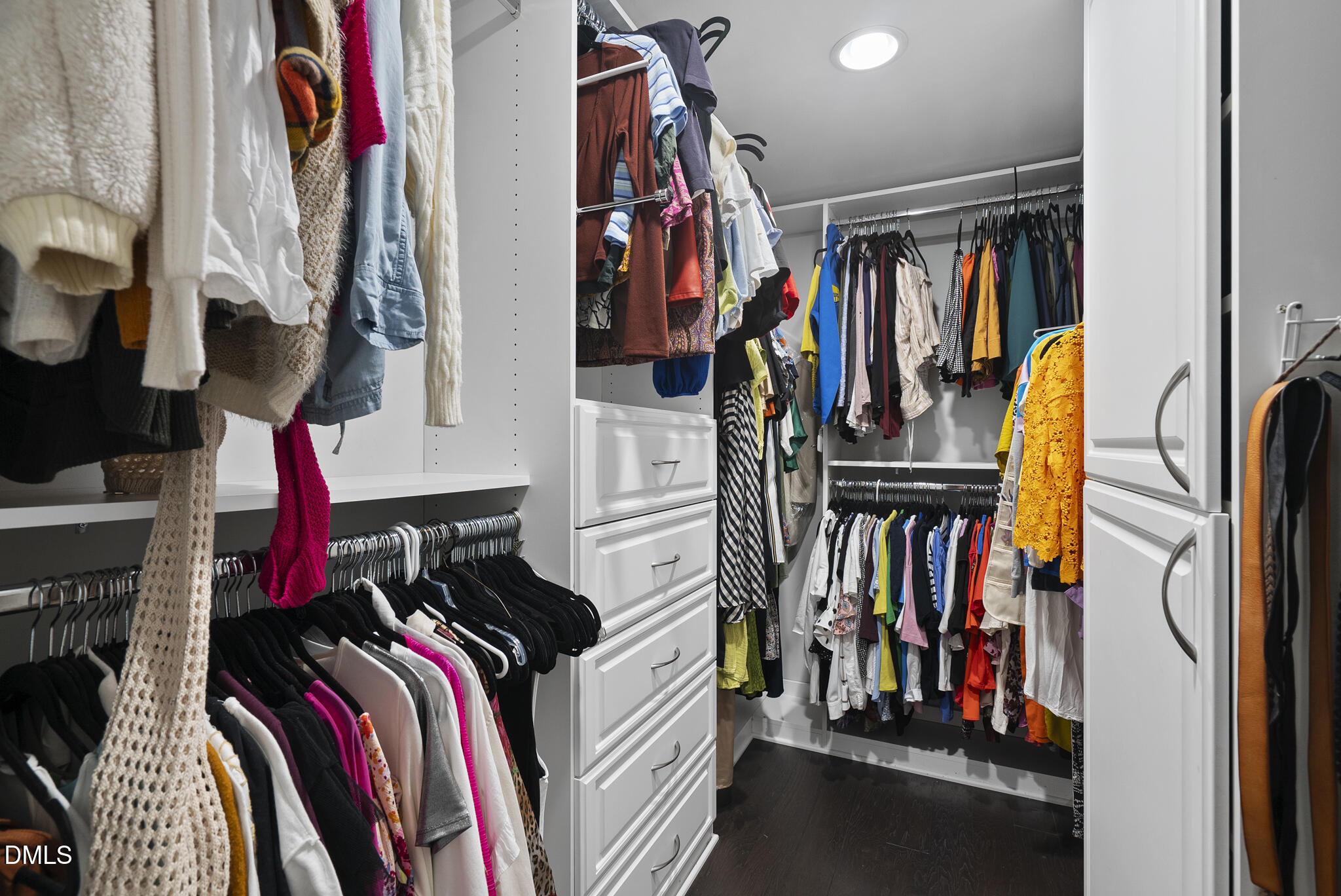 200 South Dawson Street, Unit 111 Raleigh, NC 27601 - Photo 26 of 34 a view of walk in closet with clothes and shoes