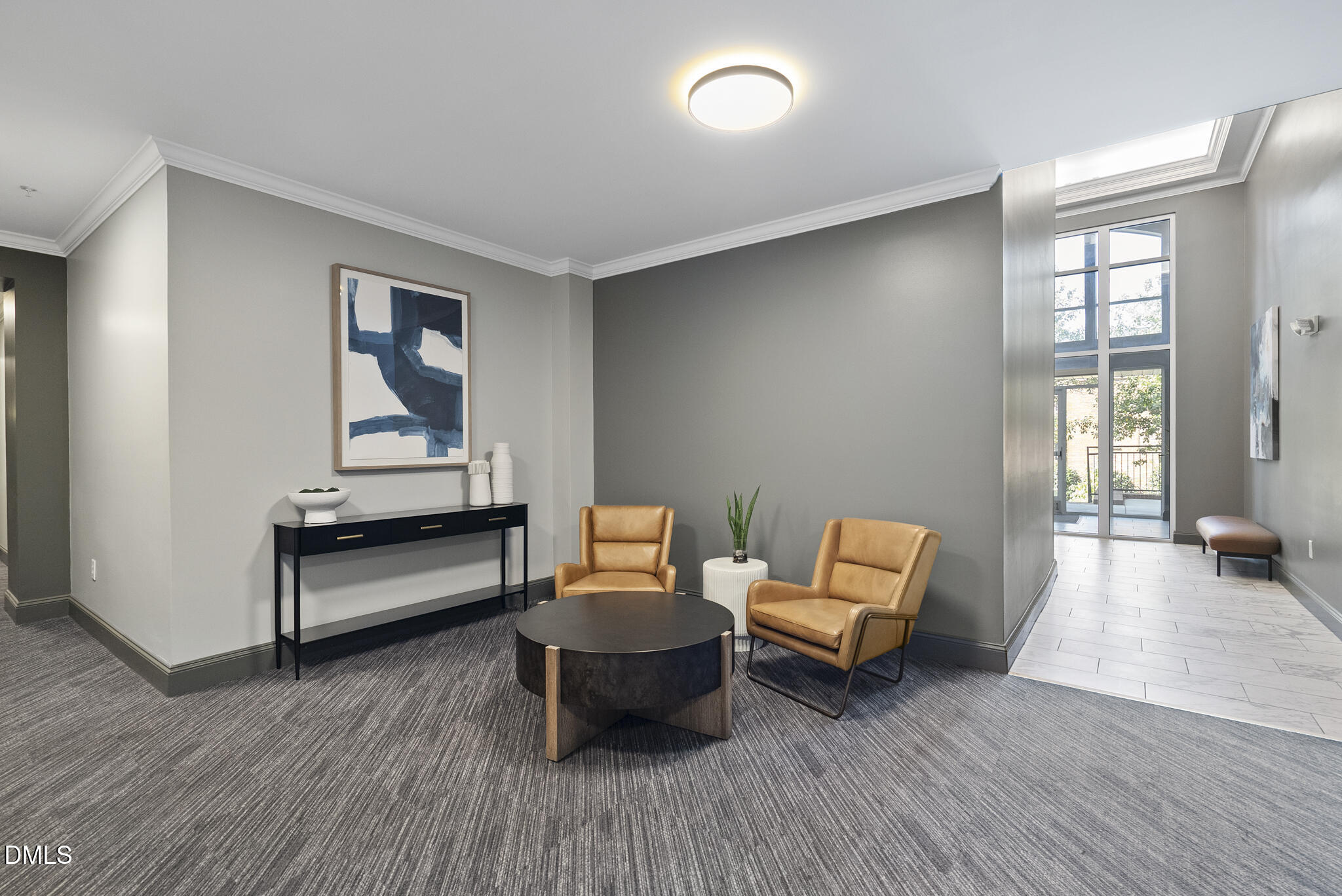 200 South Dawson Street, Unit 111 Raleigh, NC 27601 - Photo 28 of 34 a living room with furniture and a wooden floor