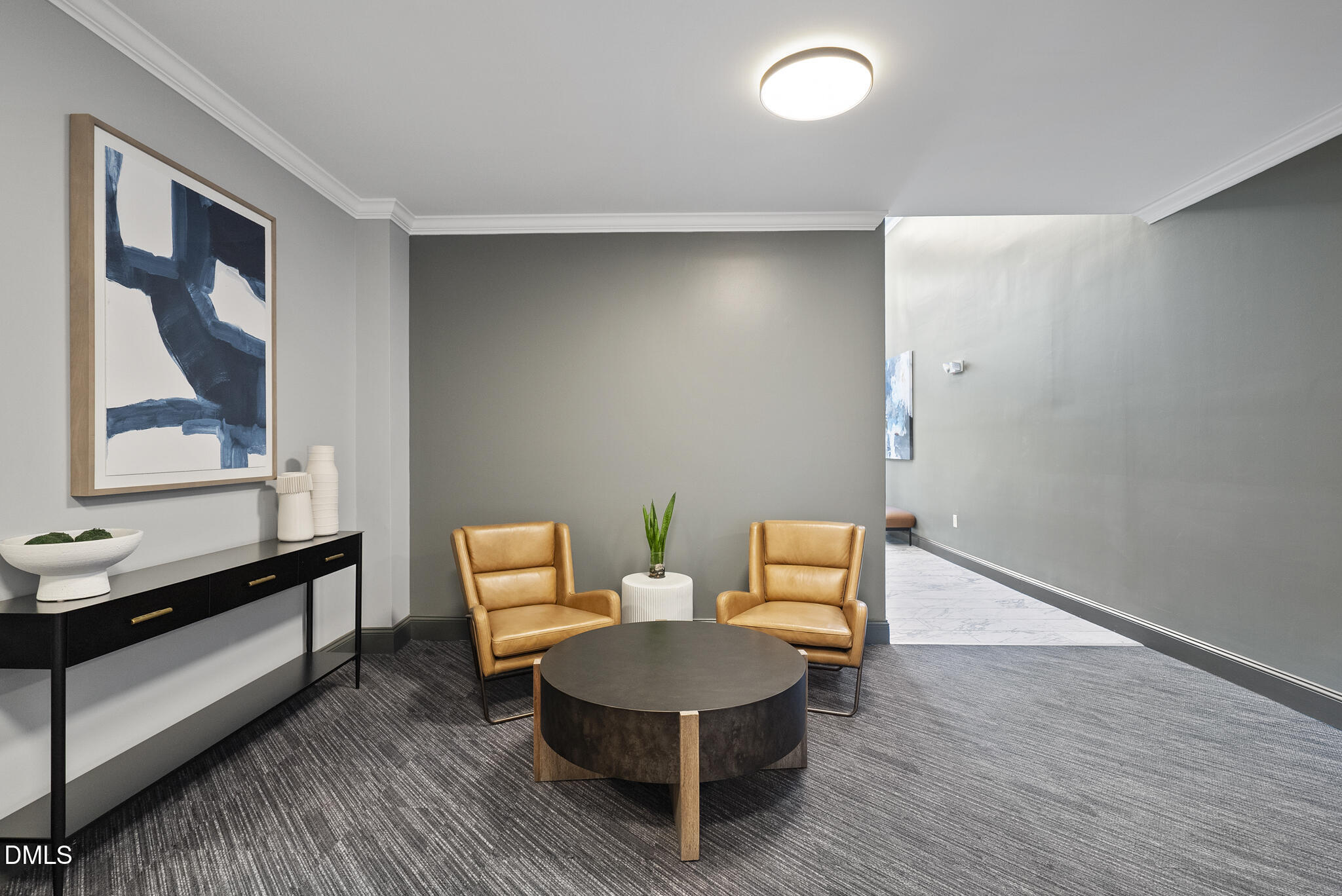 200 South Dawson Street, Unit 111 Raleigh, NC 27601 - Photo 29 of 34 a living room with furniture a lamp and a potted plant