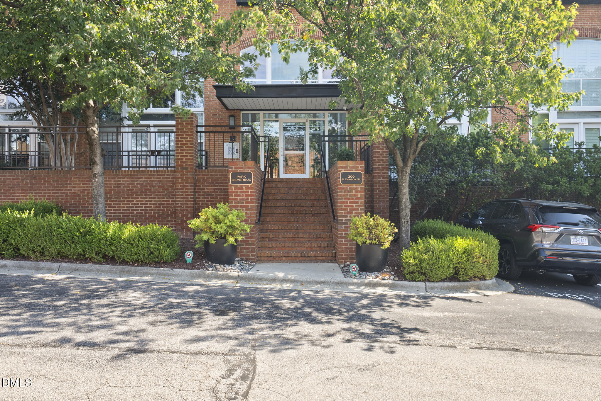 200 South Dawson Street, Unit 111 Raleigh, NC 27601 - Photo 32 of 34 a front view of a house with garden