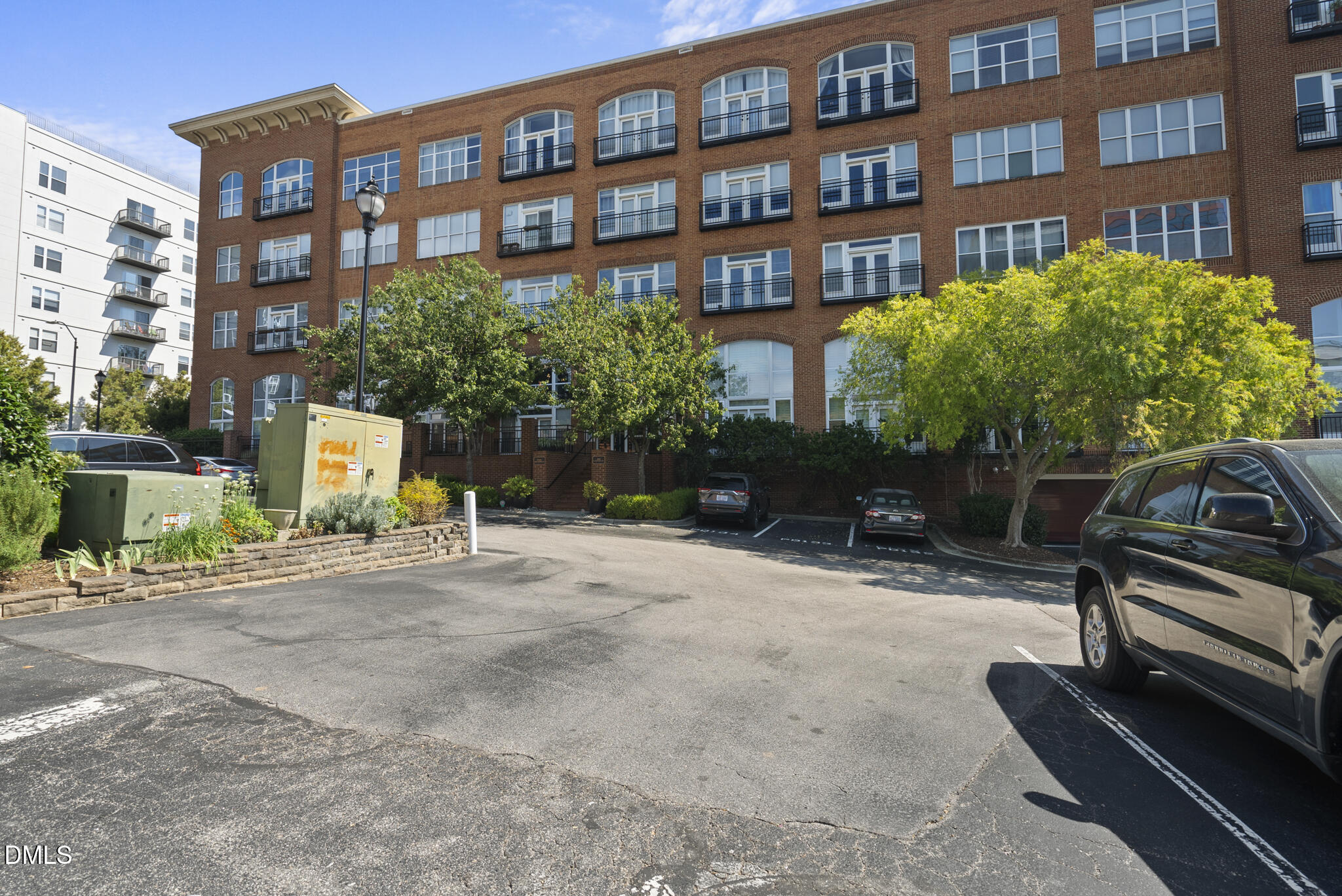 200 South Dawson Street, Unit 111 Raleigh, NC 27601 - Photo 34 of 34 a wooden bench sitting in front of a building