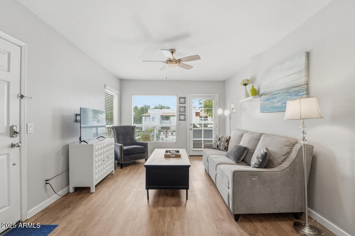 a living room with furniture and a large window